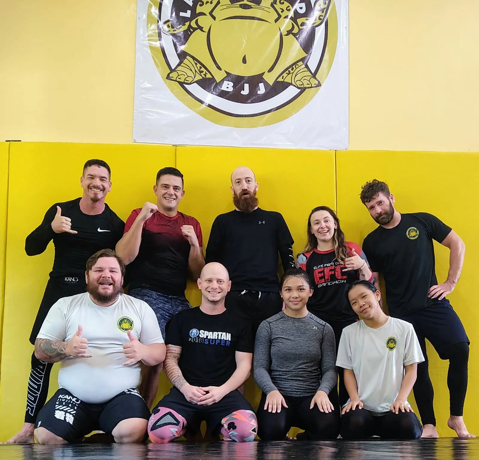 BJJ students practicing takedown techniques