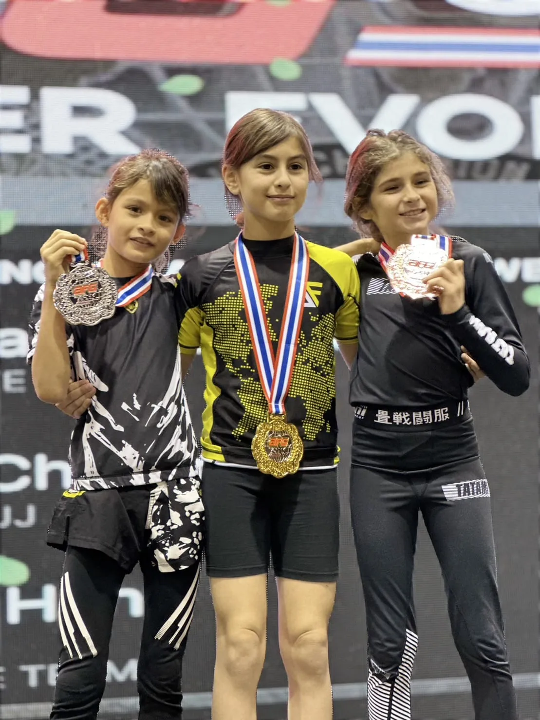 Brazilian Jiu-Jitsu students learning from experienced coaches